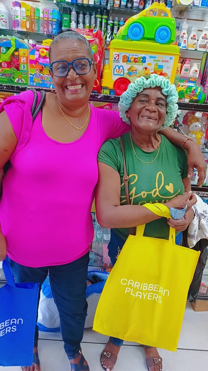 Caribbean customers with Caribbean Players bags